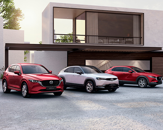 Photo de trois véhicules Mazda